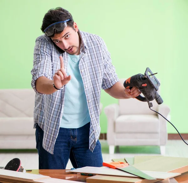 Woodworker working in his workshop — Stock Photo, Image