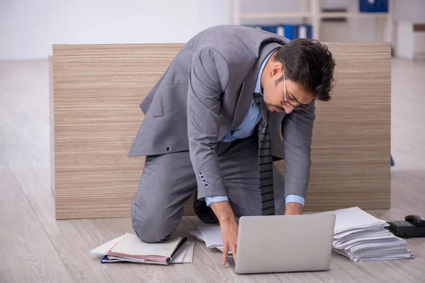 Young male employee working overtime in the office — Stock Photo, Image