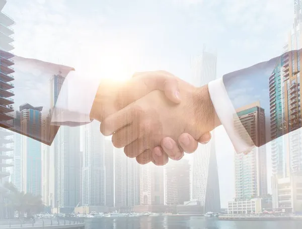 Concept of cooperation with handshake — Stock Photo, Image