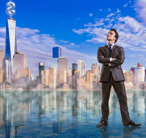 Businessman standing on the water — Stock Photo, Image