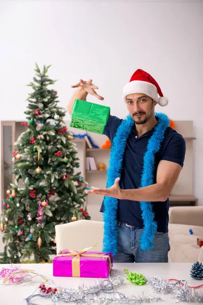 stock image Young man celebrating Christmas at home