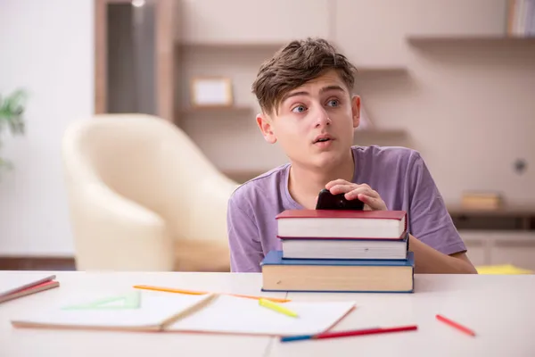 Schoolboy preparing for exams at home — Stock Photo, Image