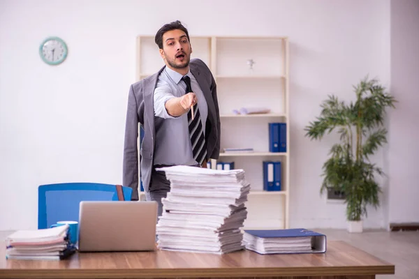 Funny young male employee magician and too much work in the office — Stock Photo, Image
