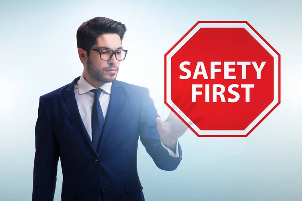 Safety first concept with businessman — Stock Photo, Image