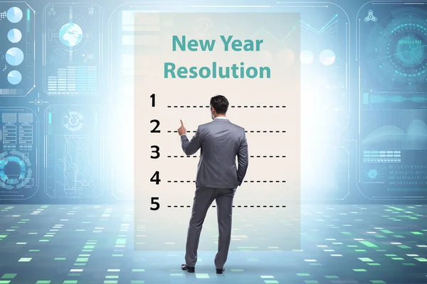 Empresário no conceito de resolução de ano novo — Fotografia de Stock
