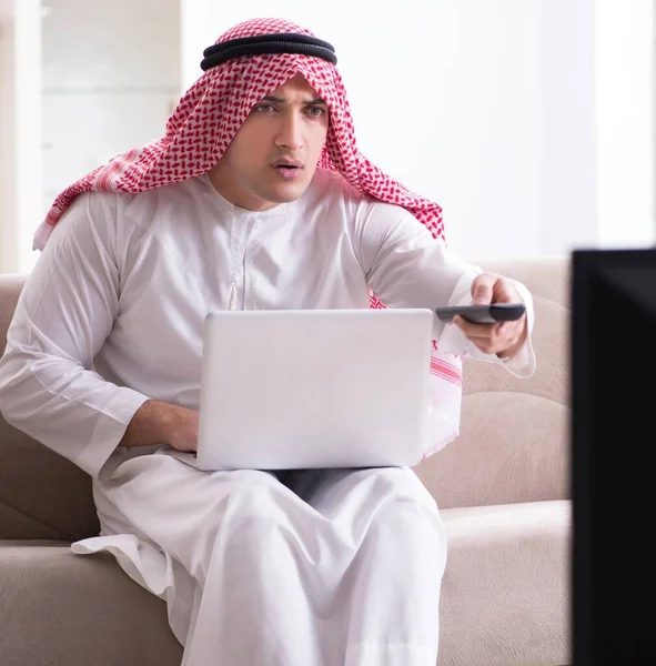 Arab man watching tv at home — Stock Photo, Image