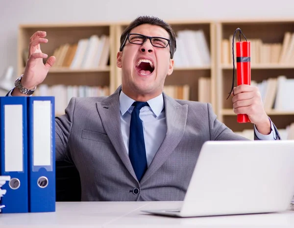 Businessman with dynamite in the office — Stock Photo, Image