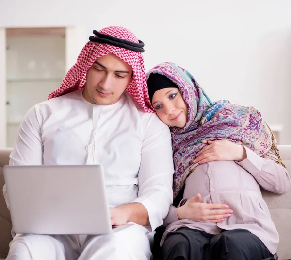 Young arab muslim family with pregnant wife expecting baby — Stock Photo, Image