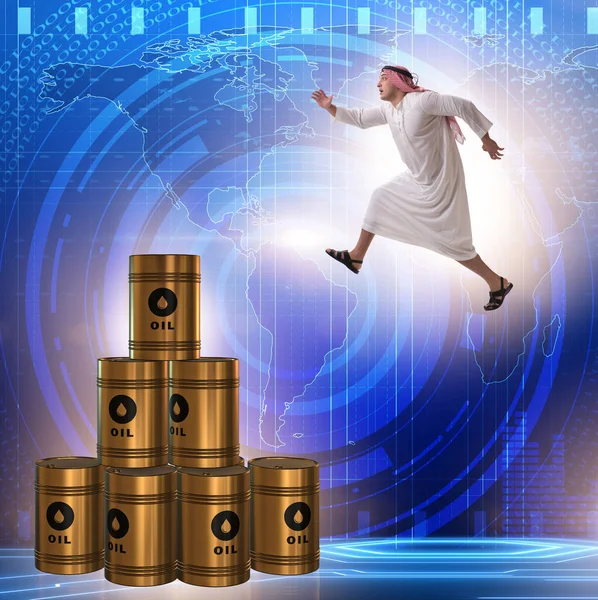 Empresario árabe saltando de barriles de petróleo — Foto de Stock