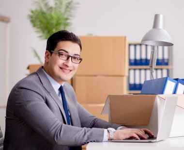 Businessman moving offices after promotion clipart