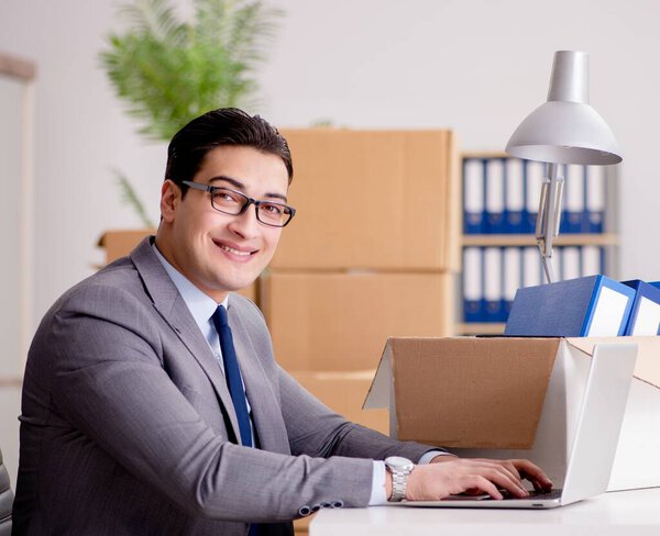 Businessman moving offices after promotion