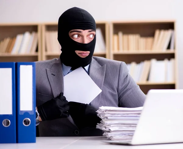 Criminal businessman wearing balaclava in office — Stock Photo, Image