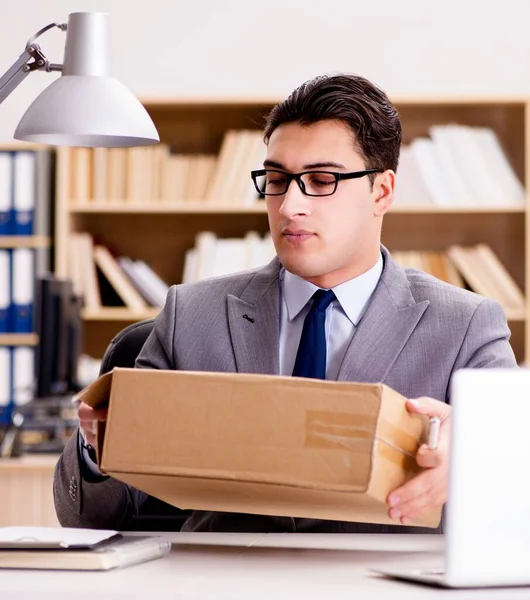 Businessman receiving parcel in office — Stock Photo, Image