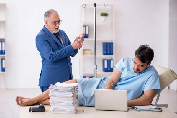 Young male employee feeling bad at workplace