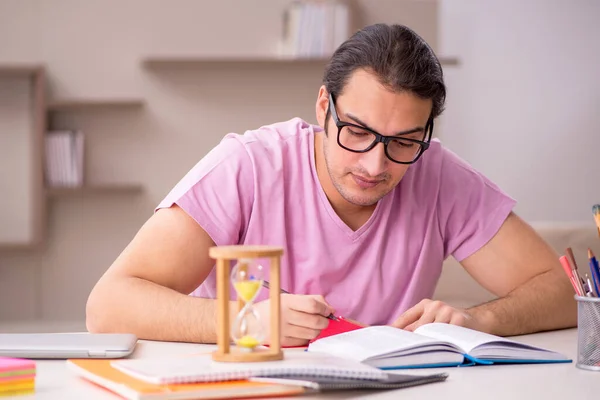 Young male student in time management concept — Stock Photo, Image