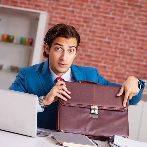 The young handsome employee working in the office — Stock Photo, Image