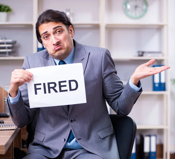 Young male employee being fired from his work — Stock Photo, Image