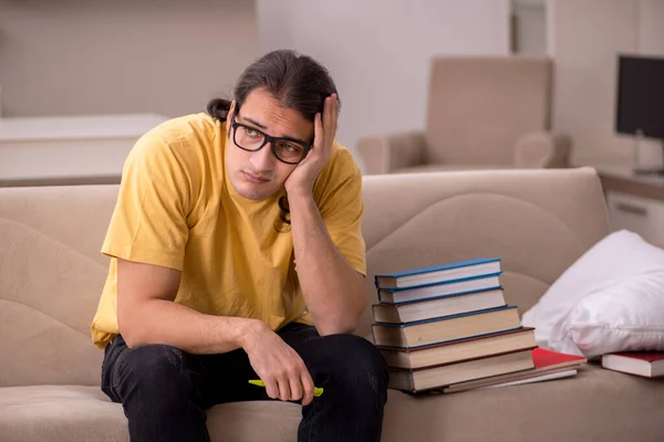 Young male student preparing for exams at home — Stock Photo, Image