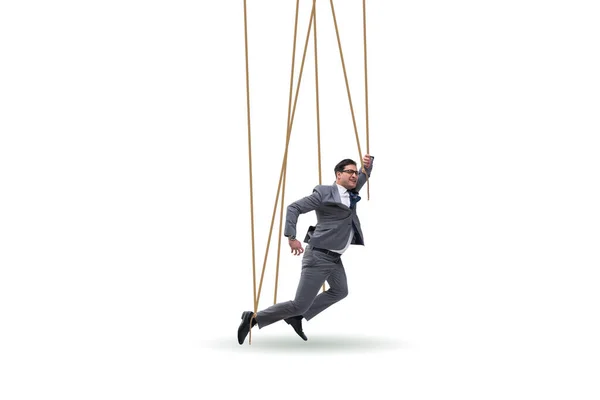Marionetka biznesmena manipulowana linami — Zdjęcie stockowe