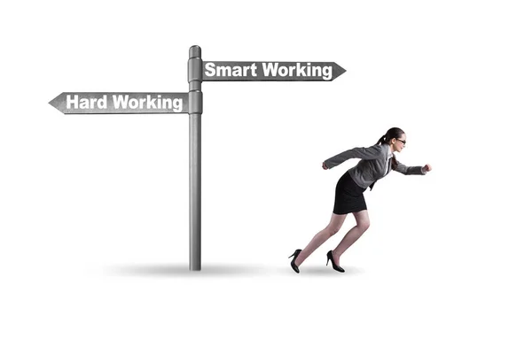 Businesswoman at the crossroads on working smart or hard — Stock Photo, Image