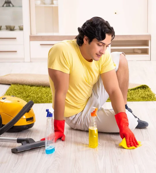 The young handsome man doing housework — Stock Photo, Image