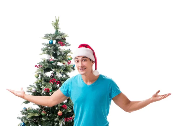 Young man decorating christmas tree isolated on white — Stock Photo, Image