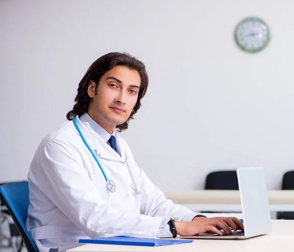 Young handsome doctor in telemedicine concept — Stock Photo, Image