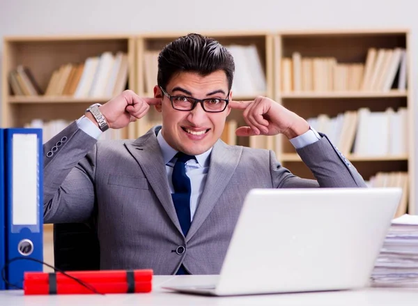 Businessman with dynamite in the office — Stock Photo, Image