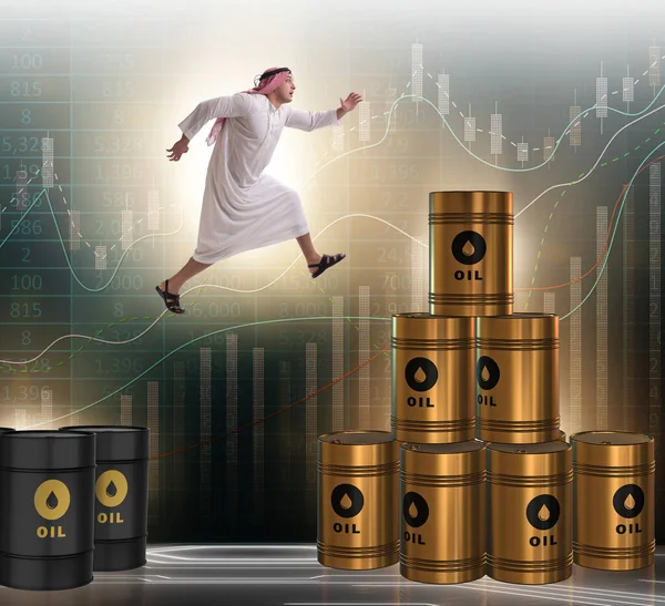 Empresario árabe saltando de barriles de petróleo —  Fotos de Stock