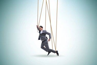 İş adamı kuklası iplerle manipüle ediliyor