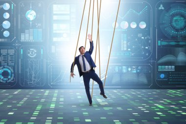 İş adamı kuklası iplerle manipüle ediliyor