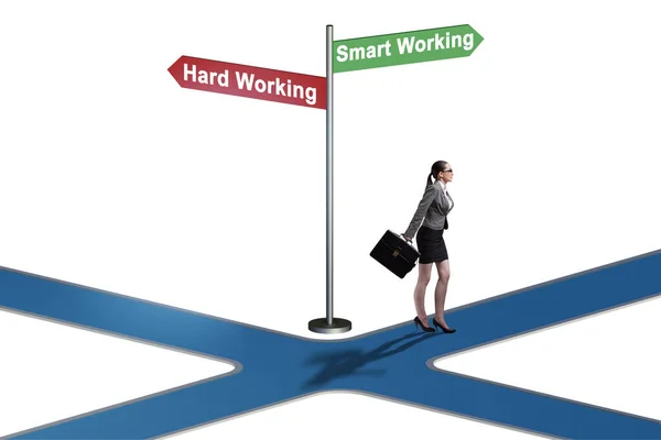 Businesswoman at the crossroads on working smart or hard — Stock Photo, Image