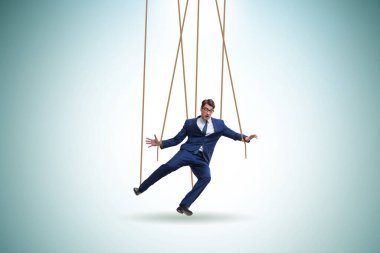 İş adamı kuklası iplerle manipüle ediliyor