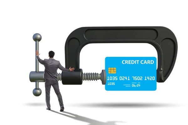 Concept of credit card debt with clamp and businessman — Zdjęcie stockowe