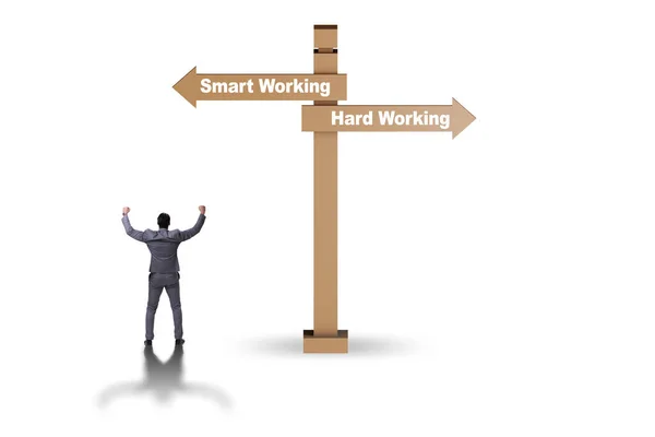 Businessman at the crossroads on working smart or hard — Stock Photo, Image