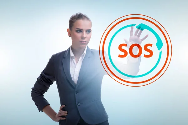 Businesswoman pressing SOS button in case of danger — 图库照片