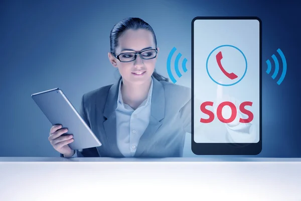 Businesswoman pressing SOS button in case of danger — Stock Photo, Image