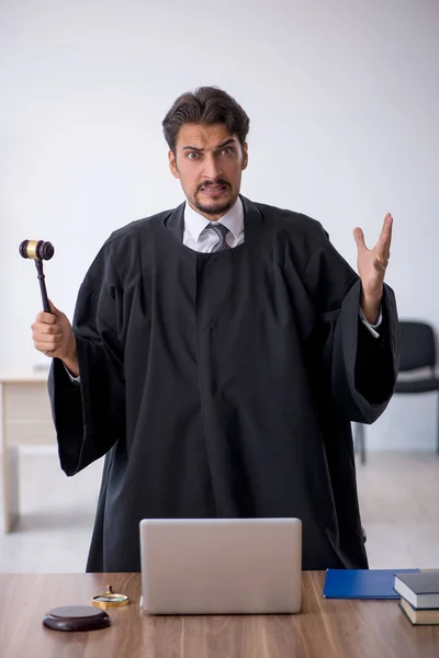 Young male judge working in the courthouse — Stock Photo, Image