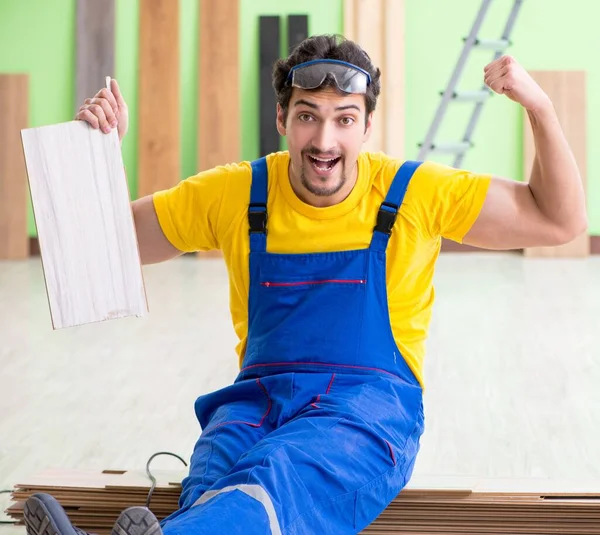 Professional contractor laying flooring at home — Stock Photo, Image