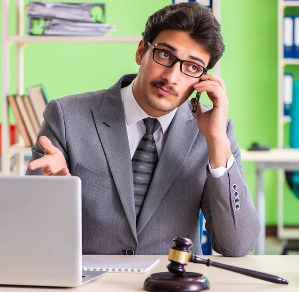 Young handsome lawyer working in the office — Stock Photo, Image