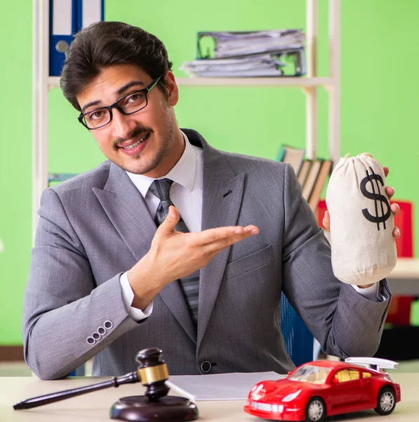 Young handsome lawyer working in the office — Stock Photo, Image