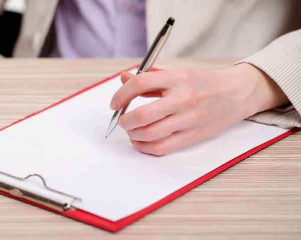 Hands taking notes in the pad — Stock Photo, Image