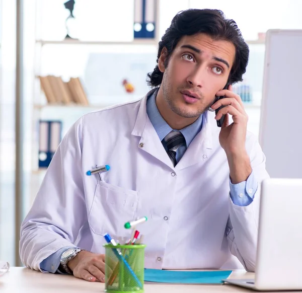 The young handsome doctor in front of whiteboard — Photo