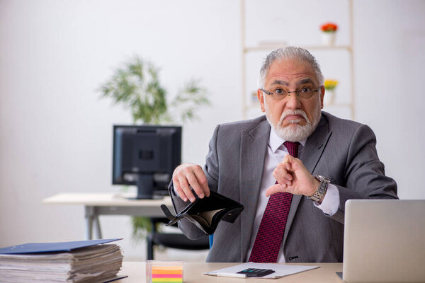 Old male employee in remuneration concept