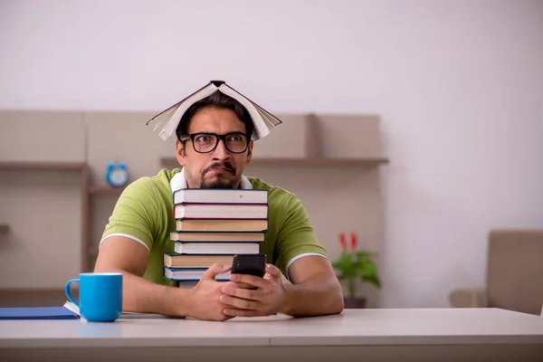 Young male student studying at home — Stock Photo, Image