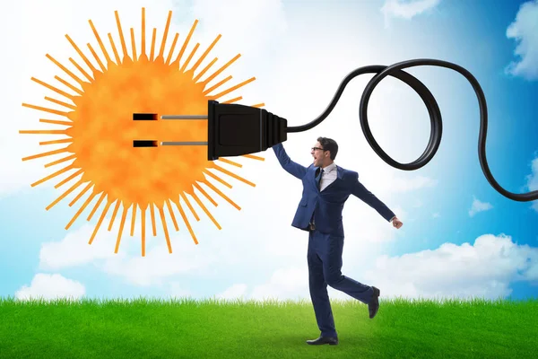 Güneş enerjisi kavramında iş adamı — Stok fotoğraf