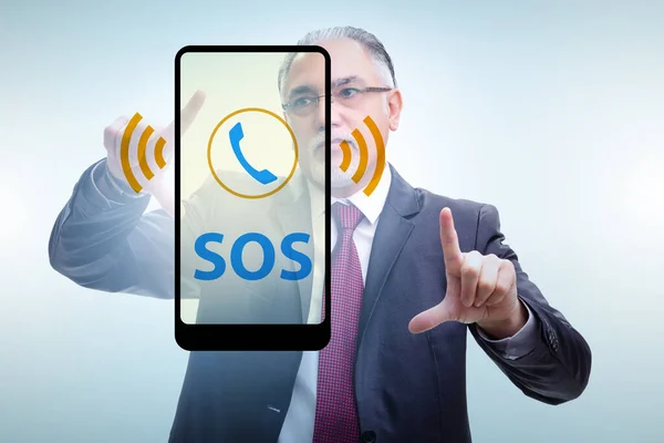 Businessman pressing SOS button in case of danger — Stock Photo, Image
