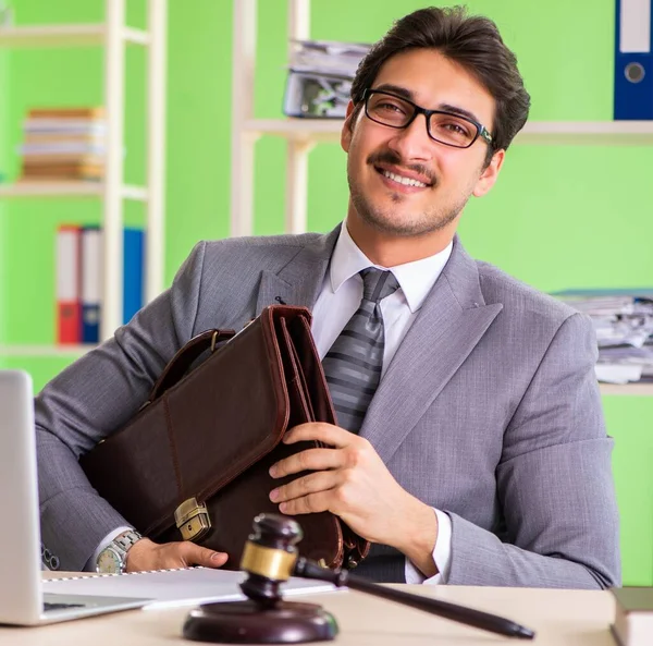 Young handsome lawyer working in the office — Stock Photo, Image