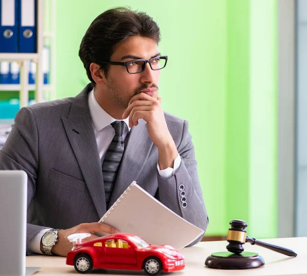 Young handsome lawyer working in the office — Stock Photo, Image