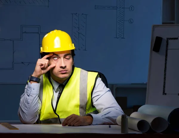 The young construction architect working on project at night — Stock Photo, Image